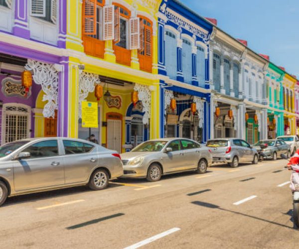 George Town, Penang Island Malaysia. March 8 2019. A street scene with people in George Town Malaysia. George Town is the colorful, multicultural capital of the Malaysian island of Penang. The city is known for its British colonial buildings, Chinese shophouses and mosques.