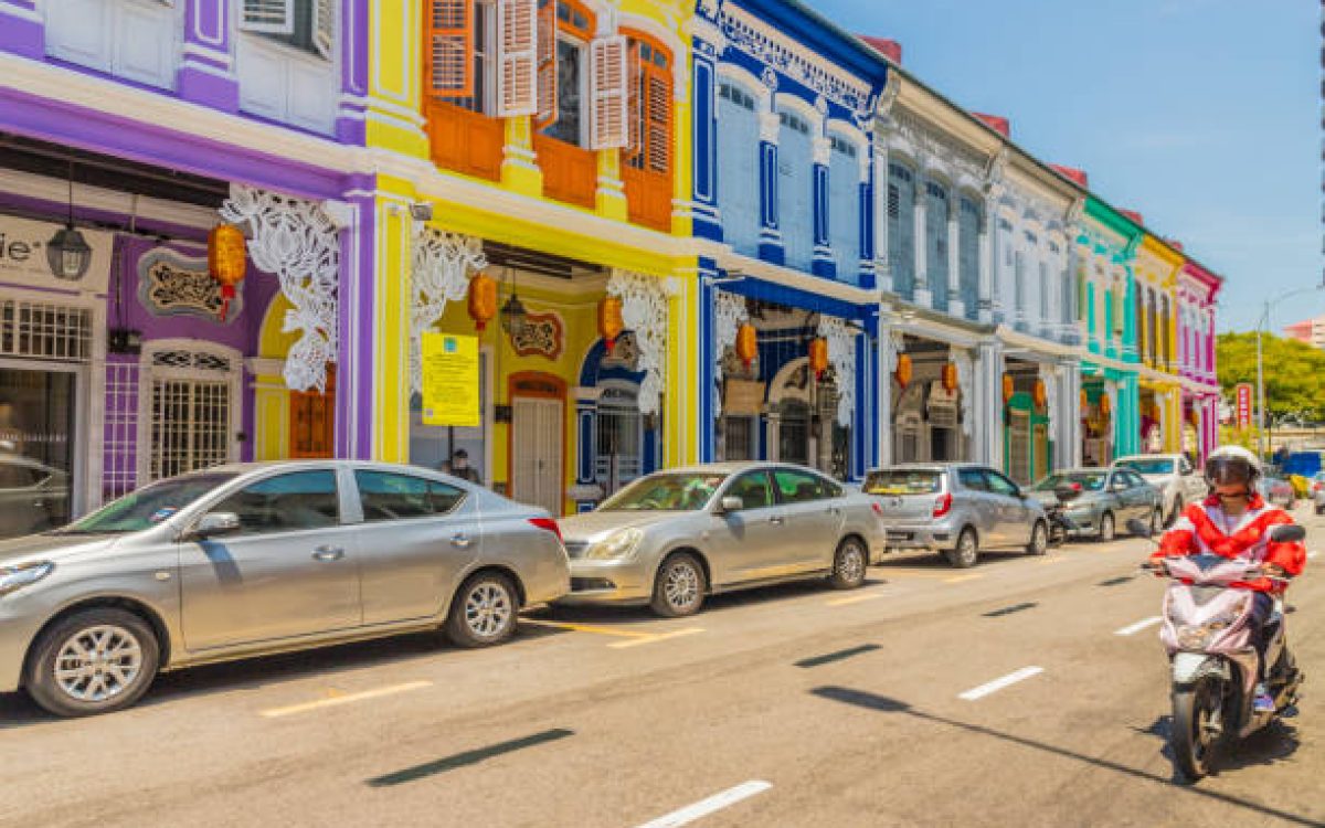 George Town, Penang Island Malaysia. March 8 2019. A street scene with people in George Town Malaysia. George Town is the colorful, multicultural capital of the Malaysian island of Penang. The city is known for its British colonial buildings, Chinese shophouses and mosques.